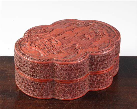 A Chinese cinnabar lacquer sexafoil box and cover, Qianlong / Jiaqing period, width 16.2cm, slight damage